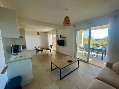 Bright open-plan apartment at Résidence Marina di Bravone with kitchen, living area, and sea-view balcony in Linguizzetta