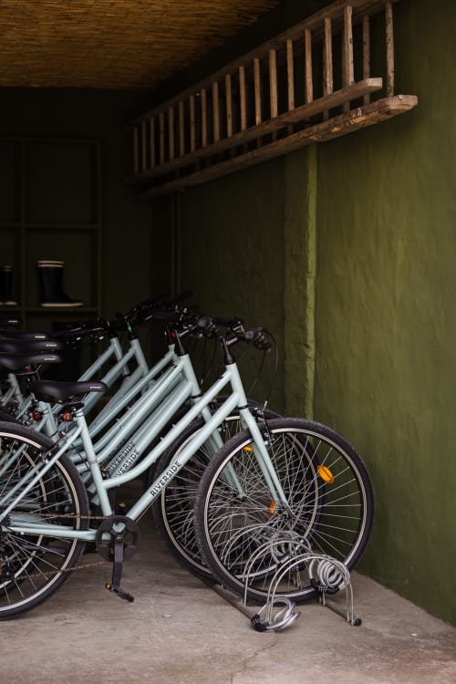 White rental bikes parked in storage at Moulin Moulin B&B in Dannes, France