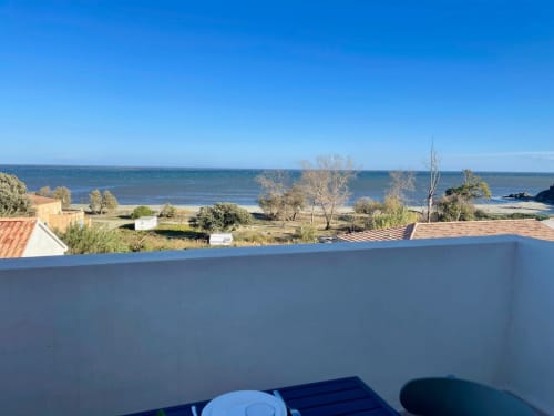 Panoramic sea view from Marina di Bravone apartment balcony overlooking coastal landscape and beach