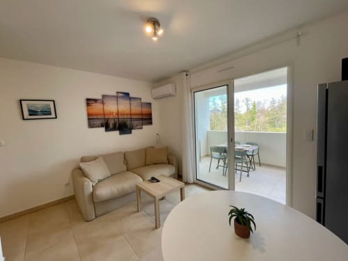Cosy beachfront apartment at Marina di Bravone with modern living area, terrace view, and sea-facing windows