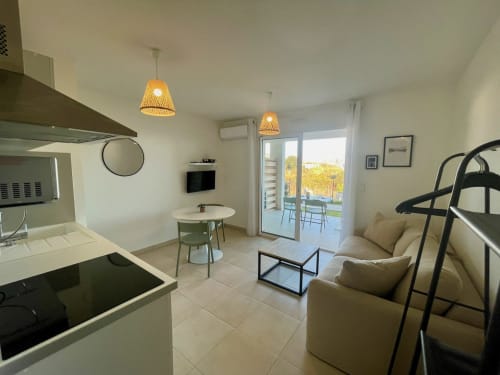 Modern T2 apartment at Résidence Marina di Bravone, Linguizzetta with open kitchen, living area, sea view terrace