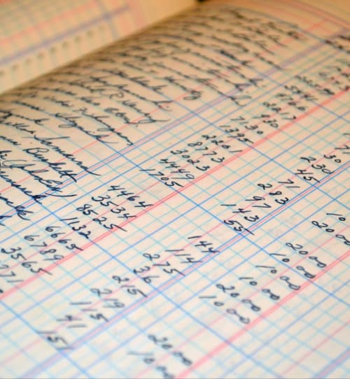 Handwritten ledger with calculations at Domaine de Cabrières guesthouse in St Jean Du Gard