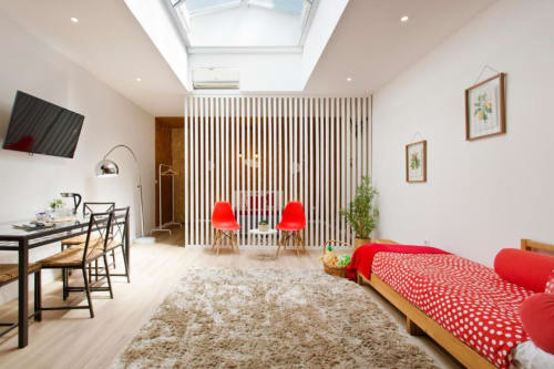 Bright Family Studio at Cem Contos Porto with red chairs, bed, skylight, dining area, and modern furnishings
