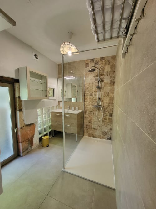 Modern bathroom in Maison de la Lune cottage at Domaine Des Forges De La Vache, Raveau with walk-in shower and wooden vanity