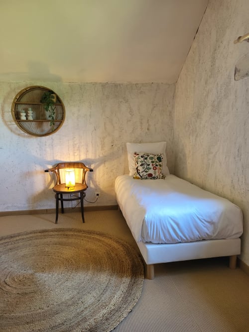Cozy bedroom in Maison de la Lune cottage at Domaine Des Forges De La Vache, Raveau with white bed and ambient lighting