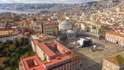 Aerial view of Naples showing Piazza del Plebiscito, historic buildings, and waterfront near Suite Maradona BnB