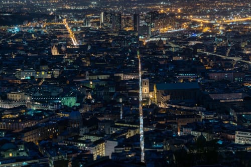 Naples nighttime cityscape with illuminated streets and church spire, Suite Maradona BnB location view