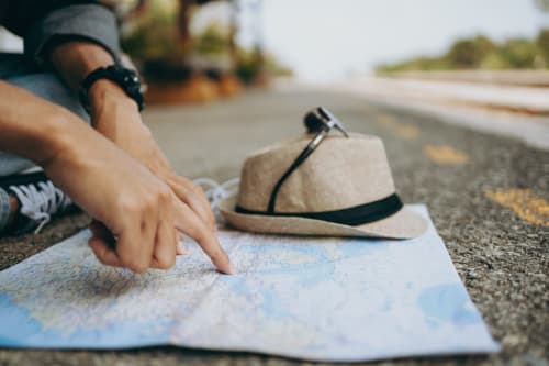 Traveler planning route on roadmap near Libre Hôtel in La Vespière, France