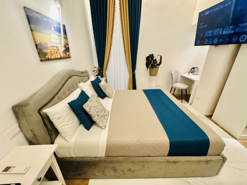 Deluxe Double Room al St Mary Major Loft di Roma con vista sulla città, TV a schermo piatto e dettagli teal