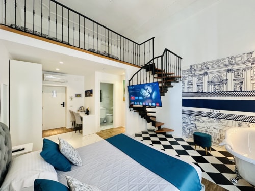 Camera Superiore Famiglia St Mary Major Loft Roma con vista città, camera moderna, scale loft e design pavimento bianco-nero