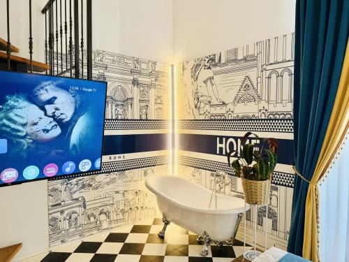 Bagno moderno al St Mary Major Loft di Roma con vasca indipendente, pavimento a scacchiera bianco e nero, e parete artistica