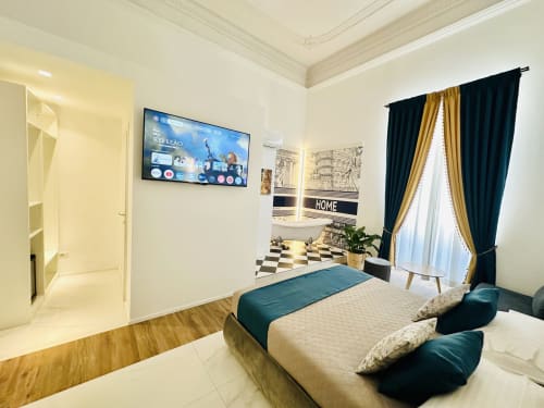 Camera Quadrupla Deluxe presso St Mary Major Loft Roma con letto, TV a schermo piatto e vista sulla città