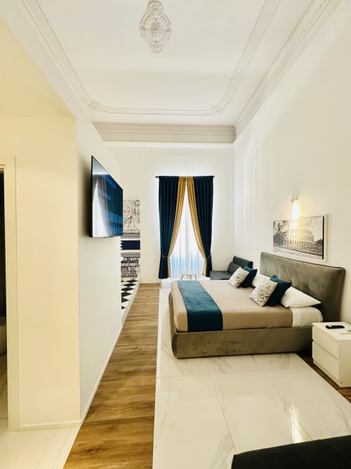 Camera Quadrupla Deluxe presso St Mary Major Loft Roma con letto queen, vista sulla città, tende oscuranti e eleganti arredi