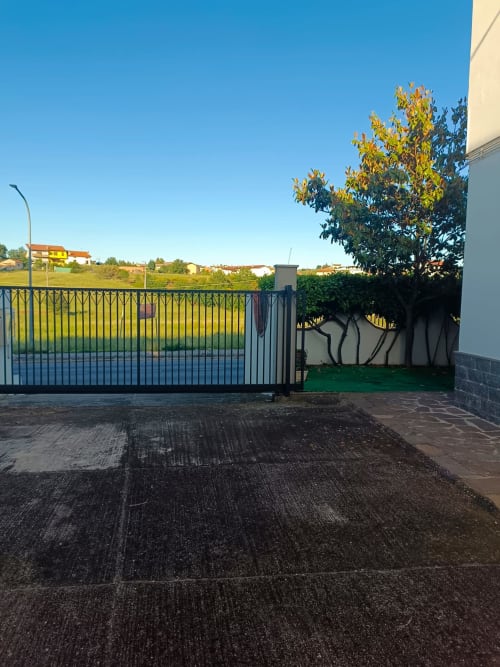Private gated driveway and garden entrance at Tales of Abruzzo apartment in Atessa, Italy, with secure fencing and landscaped