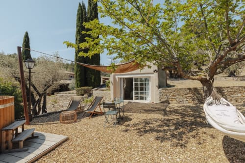 Private garden patio at Mas Tihou with loungers, hammock, and Nordic bath in Le Beausset