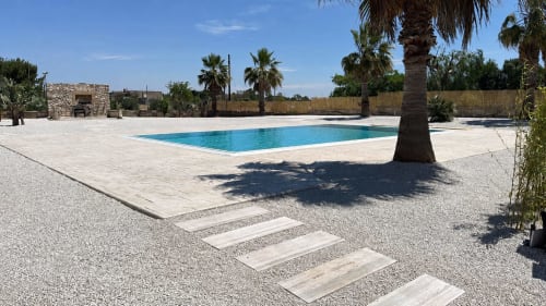 B&B Hélios swimming pool in Nardò with palm trees and stone patio