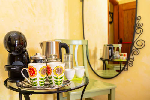 Coffee station with sunflower mugs at Agriturismo Chiai Francesco B&B in Bari Sardo, Italy