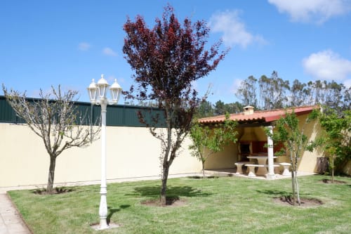 Malvarosa villa garden at Be SilverCoast with white lamp post, landscaped grounds, and terrace in Serra D'El Rei