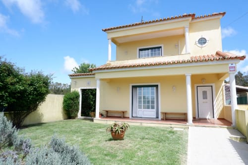 Yellow villa with terrace at Be SilverCoast, Serra D'El Rei, featuring garden view and private amenities