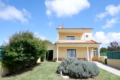 Chalé da Malvarosa villa at Be SilverCoast with garden view, yellow facade, terracotta roof in Serra D'El Rei