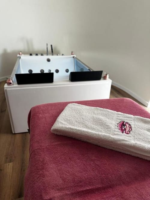Luxury spa bathtub with jets and towels at Pink-Shell B&B, Santiago de Riba-UI, Portugal