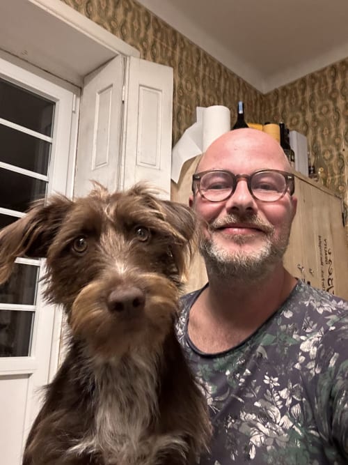 Man with glasses and dog at Pink-Shell B&B Santiago de Riba-UI Portugal
