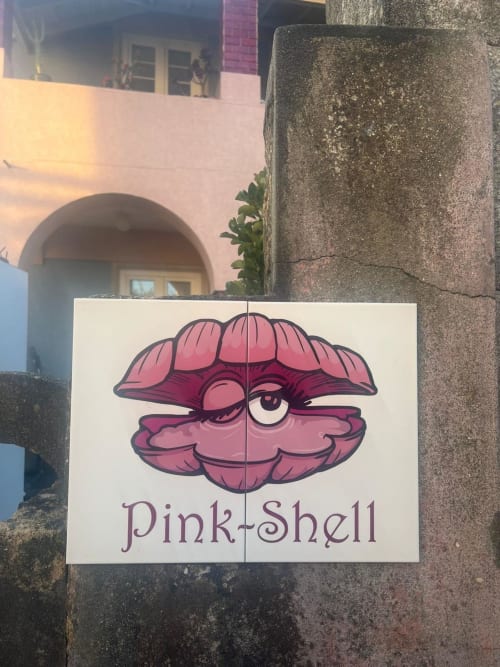 Pink Shell B&B sign with cartoon shell character in Santiago de Riba-UI, Portugal