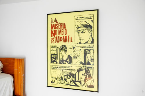 Vintage Portuguese poster with red text and comic-style illustrations on yellow background in Lisbon Poets Inn hostel room