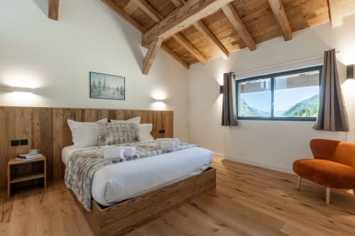 Chalet Magy 3 bedroom in Les Gets with wooden beams, mountain views, and modern furnishings at Altitudia