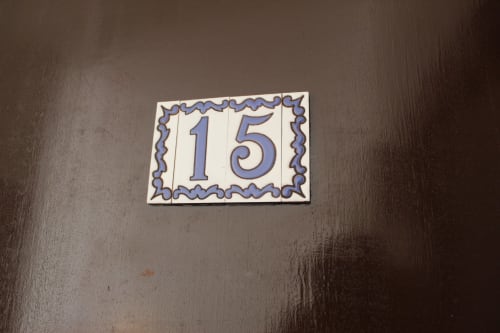 Placa de la habitación 15 en el hostal Villa Palmer de Paguera, España