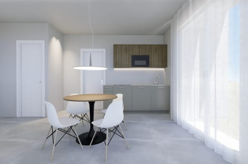 Suite Junior con Balcone moderna presso Holiday Suites con zona pranzo, cucina e luce naturale abbondante dalle finestre