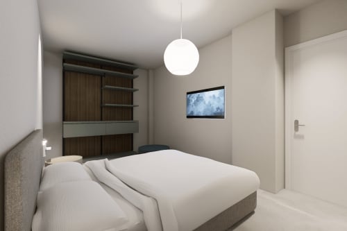 Camera della Junior Suite Balcony moderna presso Holiday Suites con design minimalista, illuminazione a sospensione e mobiletto in legno.
