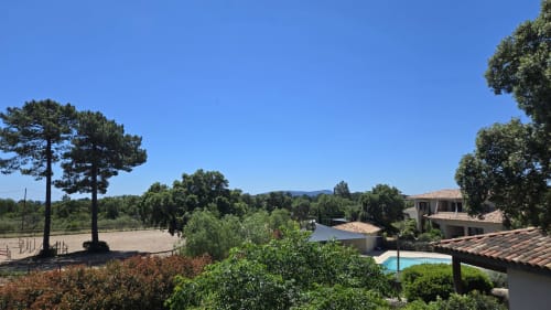 Villas Lantana in Lecci with pool, terrace, trees, and countryside views under clear sky