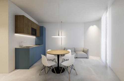 Suite moderna in città presso Holiday Suites con cucina aperta, tavolo da pranzo e zona living baciata dalla luce naturale