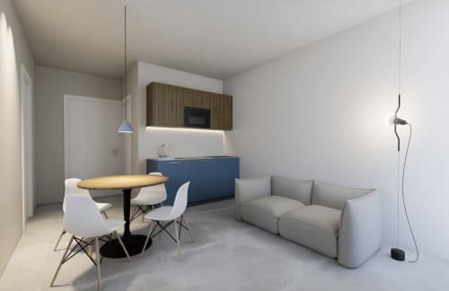 Studio moderno presso Holiday Suites con angolo cottura, tavolo da pranzo, divano grigio e arredi contemporanei