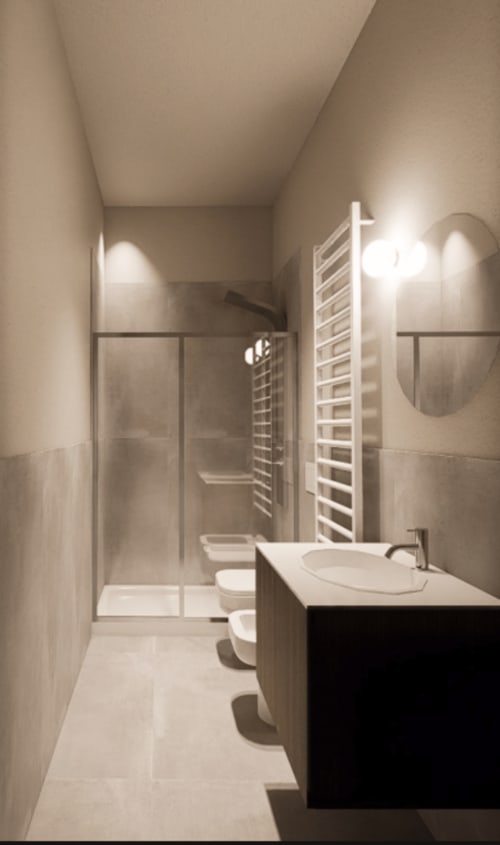 Bagno moderno nella suite 2 camere di Holiday Suites con vanity, toilette, cabina doccia, scaldasalviette e illuminazione ambiente
