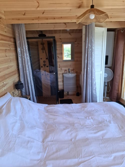 Cèdre Bleu bedroom at La Maison de Dun, Saint Racho - bed with ensuite bathroom and Jacuzzi access