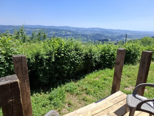 Panoramic mountain view from Douglas room at La Maison de Dun, Saint Racho, with rolling hills and vineyard landscape