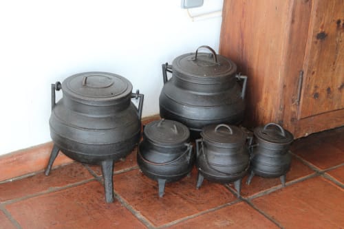 Traditional cast iron cauldrons displayed at Monte da Morena, a rustic agro-tourism property in Serpa, Portugal