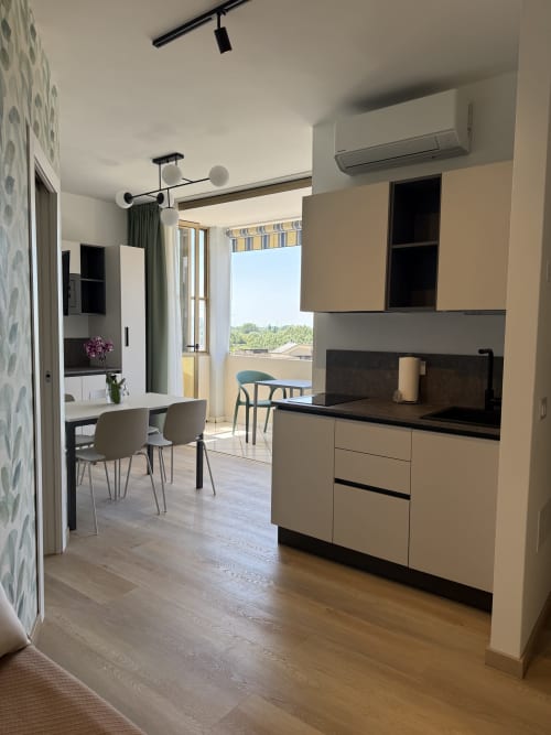 Modern kitchen and living area in Bilocale Superior apartment at Residenza Sant'Antonio, Sottomarina