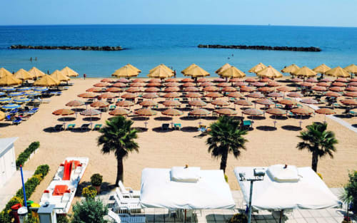 Pescara INN beach in Francavilla al Mare with umbrellas, loungers, and clear blue sea