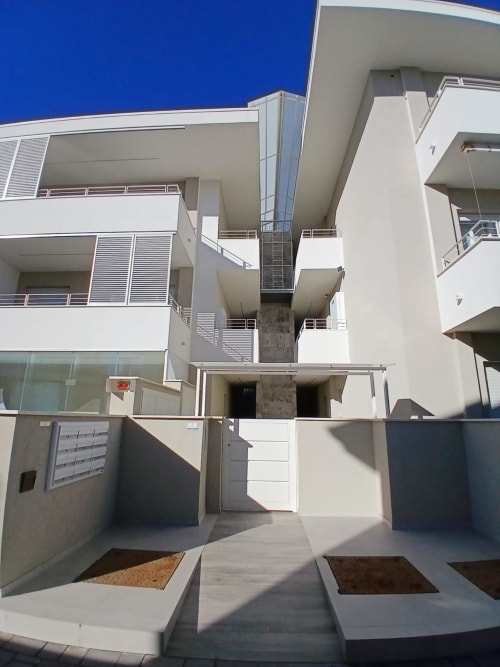 Modern white apartment building exterior at Pescara INN, Francavilla al Mare with sea views and contemporary architecture