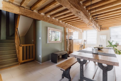 Rustic dining room with exposed wooden beams at Les Maisons de Pierre et Valérie, a charming B&B in Honfleur, France