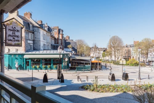 Charming Honfleur street with turquoise shop and traditional French buildings, Les Maisons de Pierre et Valérie B&B