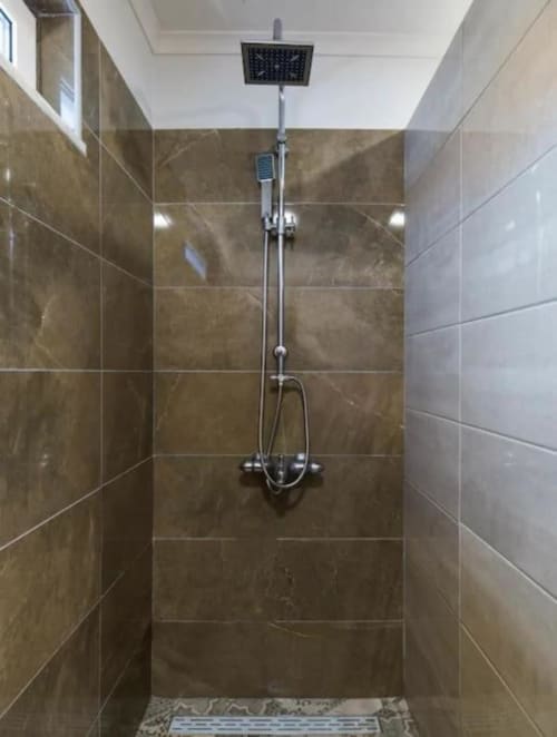 Modern shower with rainfall showerhead and hand shower in Master Villa bathroom at Quinta Boa Vida, Alcobaça