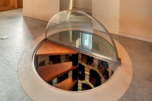 Circular glass dome revealing wooden wine cellar storage inside Master Villa at Quinta Boa Vida, Alcobaça Portugal