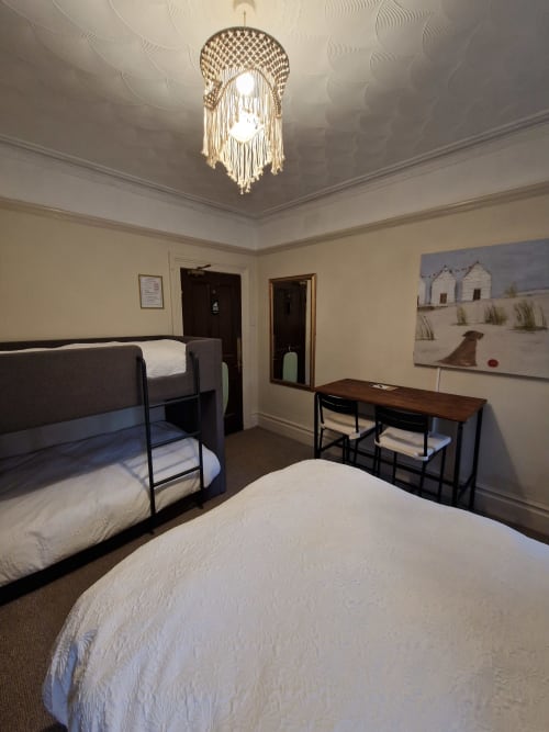 Standard Family Room at Blacksheep Lodge Holyhead with single and bunk beds, desk, and macramé pendant light