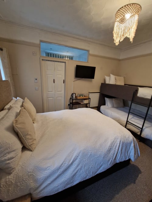 Standard Family Room at Blacksheep Lodge in Holyhead with double bed, bunk beds, TV, and modern amenities