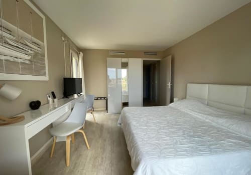 Privilege Double Room at Hôtel l'Orangeraie Lavandou with sea view, featuring modern furnishings and balcony access.