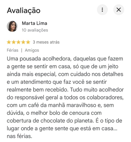 5-star review by Marta Lima for Praieira Pousada in Itacaré praising welcoming service and chocolate cake breakfast
